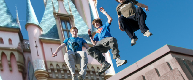 Disneyland Parkour, a new travel destination available from Adventures by Disney. Photo credit: Carterhawk [CC BY-SA 3.0] and THOR (Parkour Foundation Winter) [CC BY 2.0], both via Wikimedia Commons; modified.