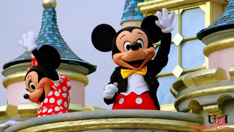 Mickey and Minnie wave to the crowds. Photo source Depositphotos_69250695_original.jpg.