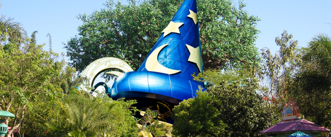 The Sorceror Mickey Hat in its new Animal Kingdom home. Photo credit Mfwills [CC BY-SA 3.0] via Wikimedia Commons and Katie Harbath [CC BY-NC-SA 2.0] via Flikr.