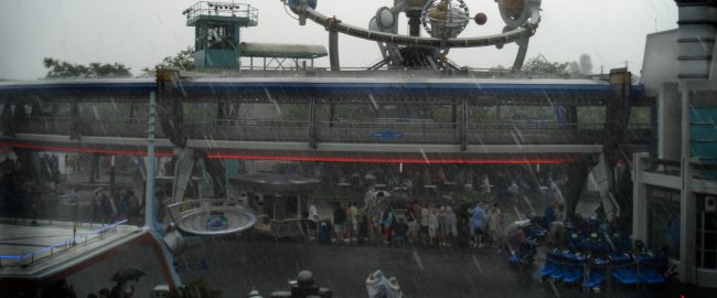 Inconsistently rainy day at Tomorrowland. Photo by Simon Kellogg [CC BY 2.0] via Flickr.