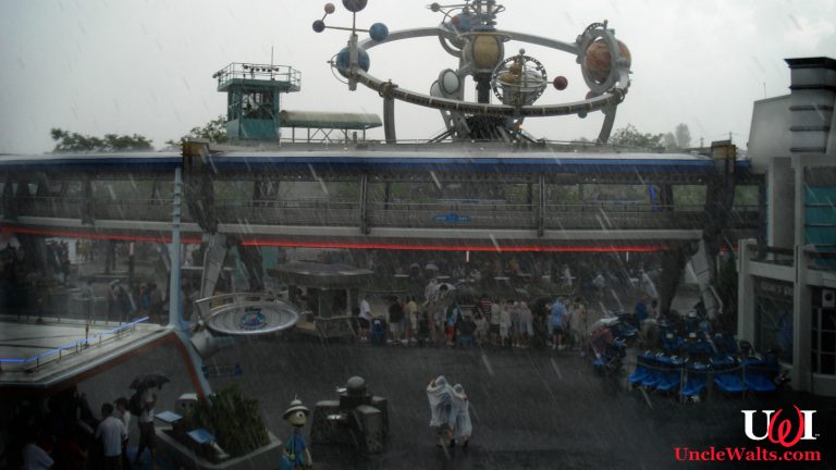 Inconsistently rainy day at Tomorrowland. Photo by Simon Kellogg [CC BY 2.0] via Flickr.