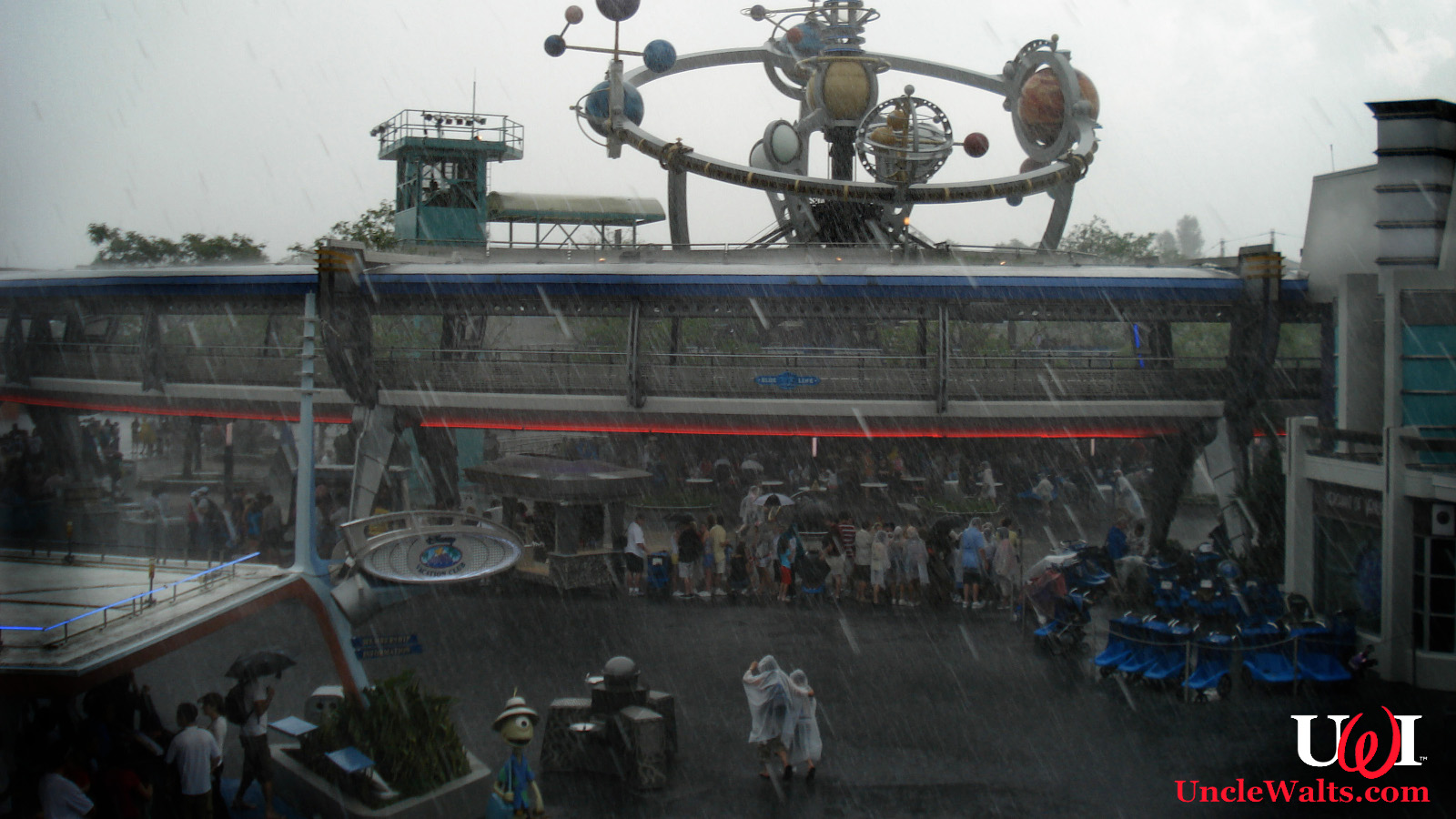 Inconsistently rainy day at Tomorrowland. Photo by Simon Kellogg [CC BY 2.0] via Flickr.