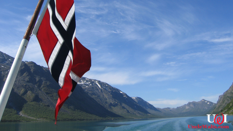 Norway (we presume) with a Norwegian flag flying. Photo by mroach [CC BY-SA 2.0] via Flickr.