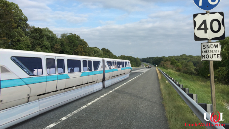 The monorail travels down Interstate 70. Photo by Famartin [CC BY-SA 4.0] via Wikimedia Commons & mbtskoudsalg.com.