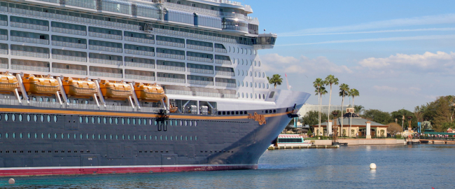 The Disney Dream anchored at Epcot. Photo courtesy Depositphotos & Theme Park Tourist [CC BY 2.0] via Wikimedia Commons.