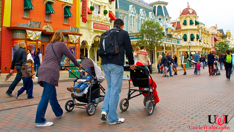 A family walks down Main Street with two non-rented children. Photo by DepositPhotos.
