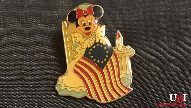 A pin shows Minnie Mouse with a racist flag. Photo by AntiquesNavigator.com.