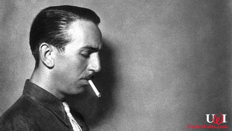 Someone strongly resembling Walt Disney holding some kind of smoldering stick. Photo by Fototeca Storica Nazionale./Getty Images.