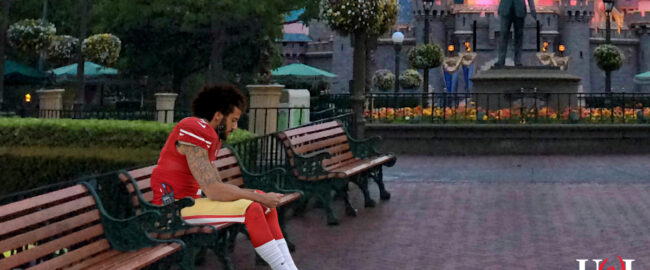 Colin Kaepernick, looking quite at home at Disneyland. Photo by Melissa Hillier [CC BY-2.0] via Wikimedia.