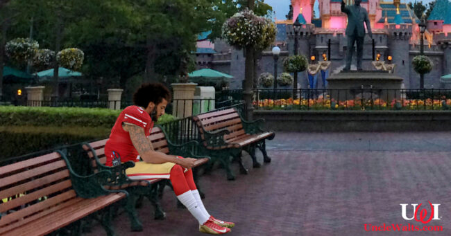 Colin Kaepernick, looking quite at home at Disneyland. Photo by Melissa Hillier [CC BY-2.0] via Wikimedia.