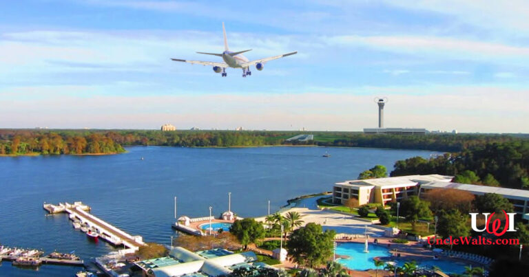 A passenger jet on final approach over Bay Lake, as seen from the Contemporary Hotel. Photo by Mike Belobradic via YouTube, TheMightyQuill [CC BY 2.0] via Flickr, and maybe a couple of others. We lose track.